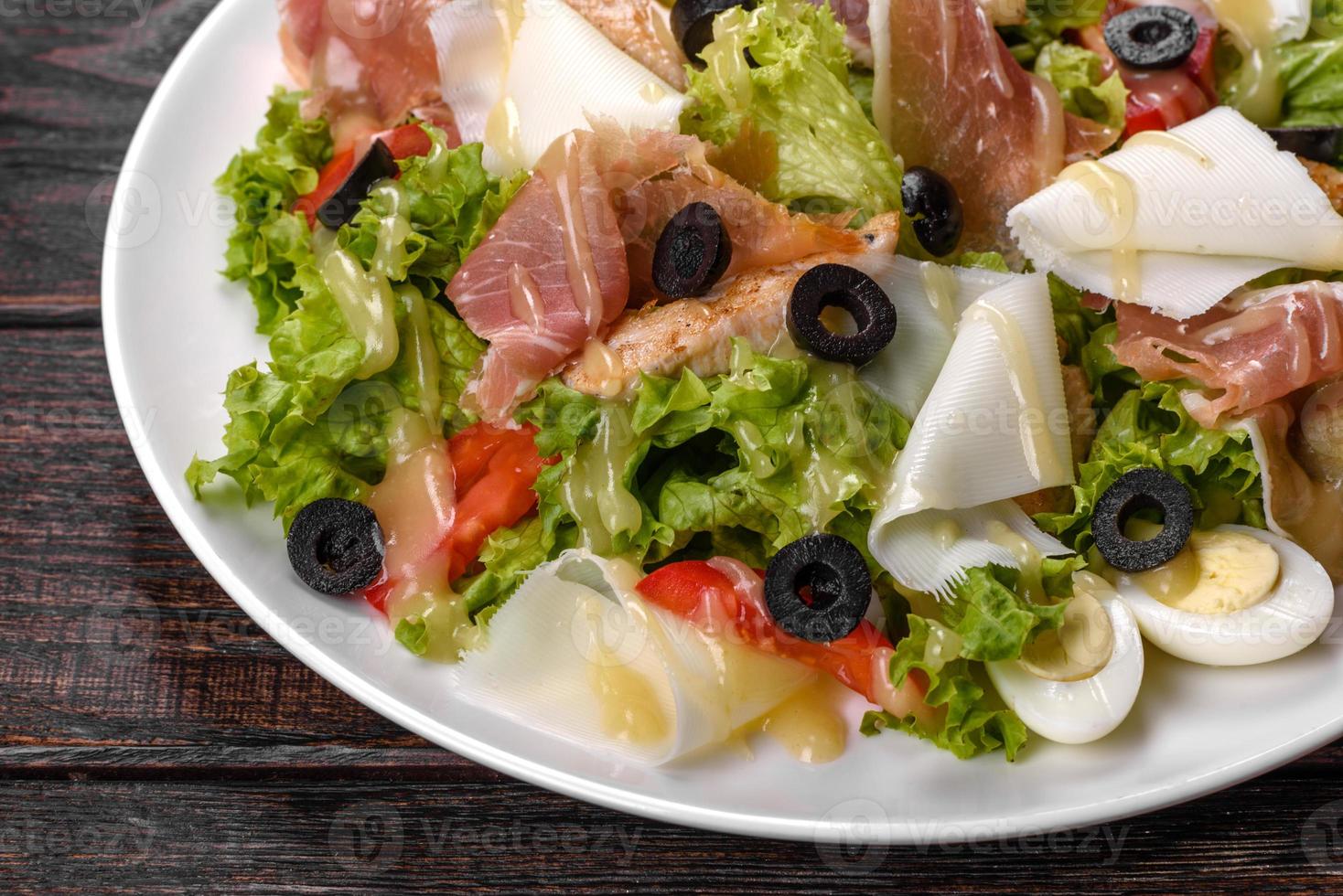 Delicious fresh salad with bacon for the festive table photo