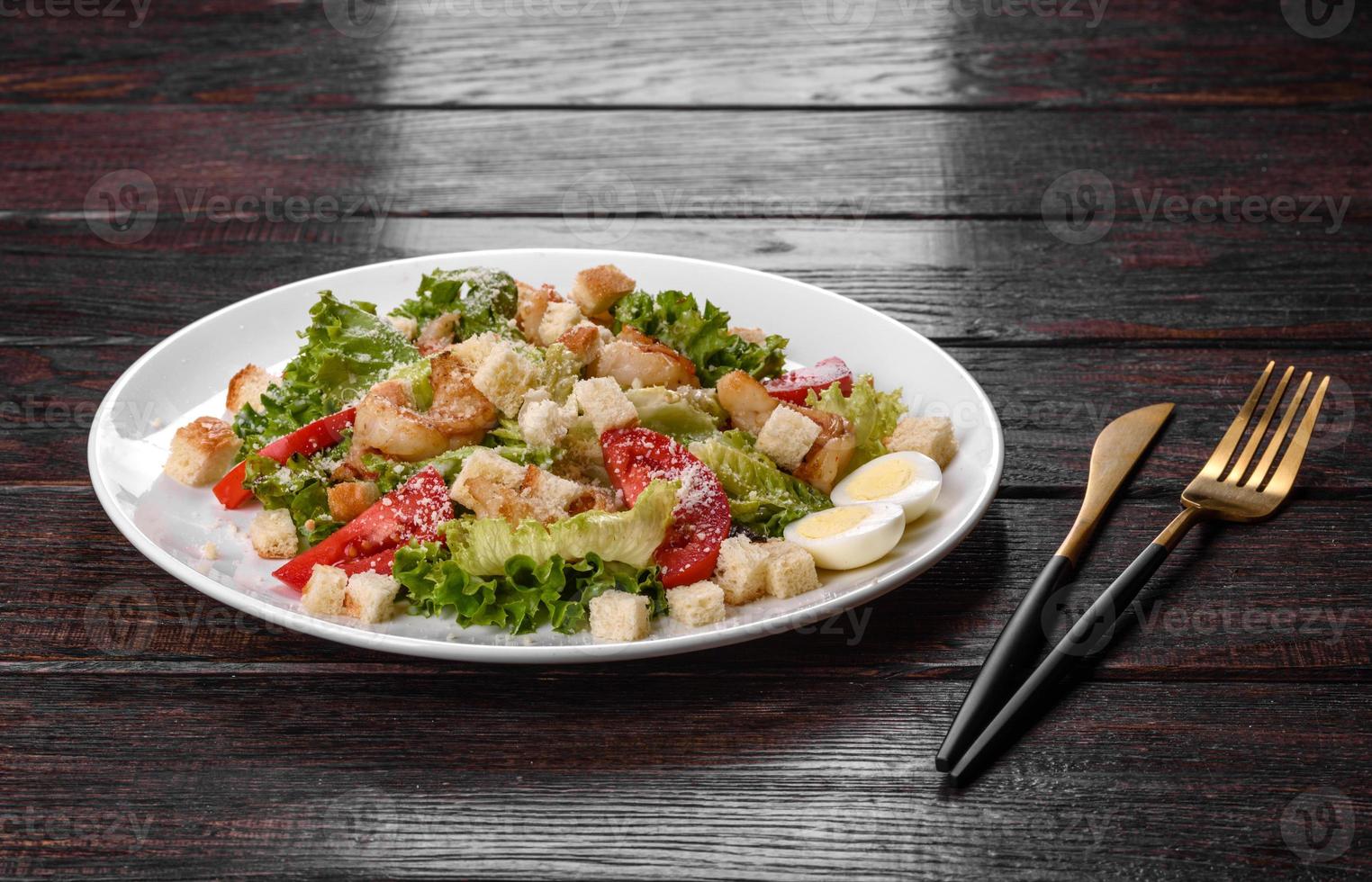 Delicious fresh salad with shrimp for the festive table photo