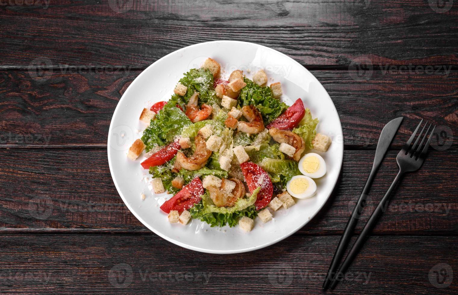 Delicious fresh salad with shrimp for the festive table photo