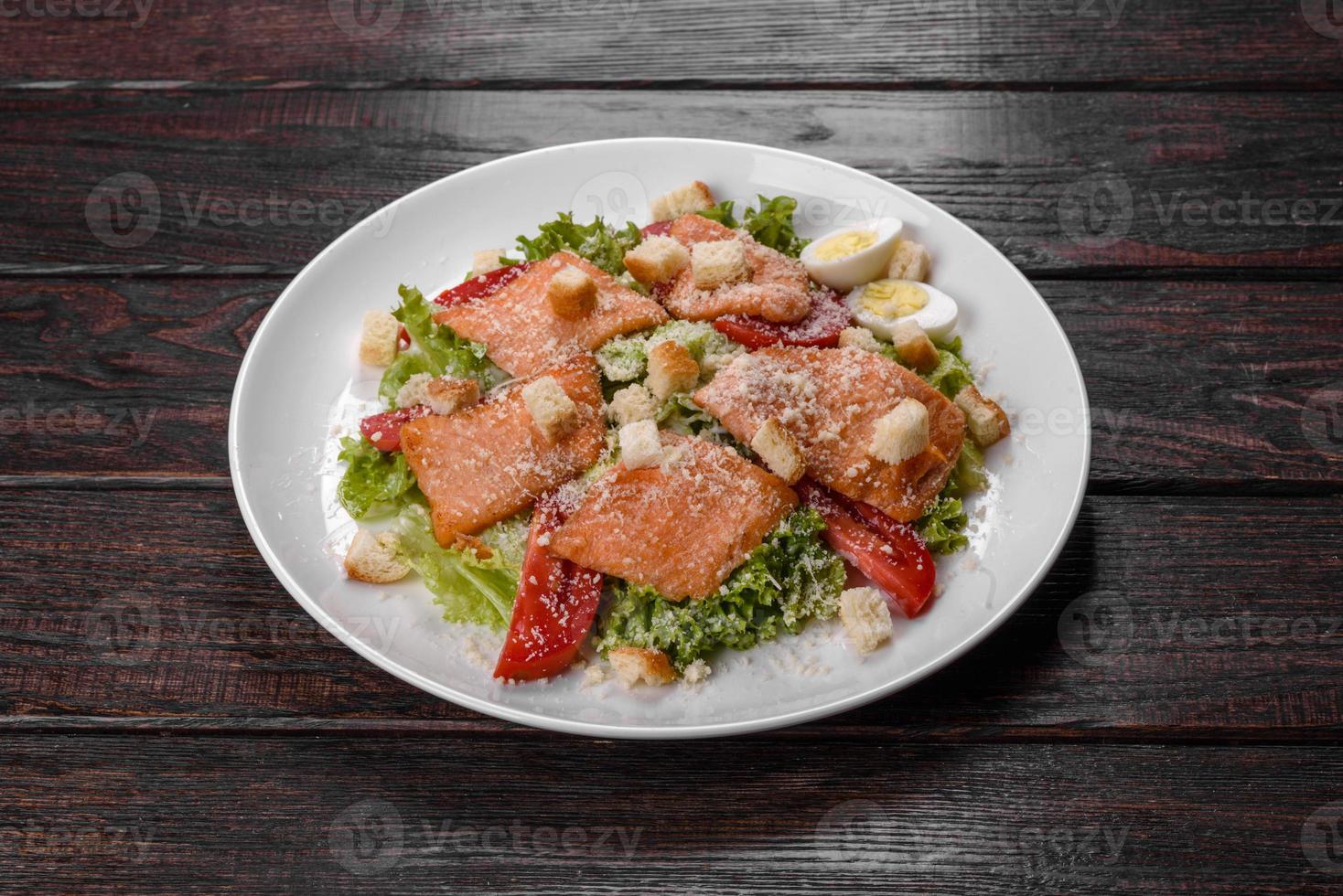 Delicious fresh salad with red fish for the festive table photo