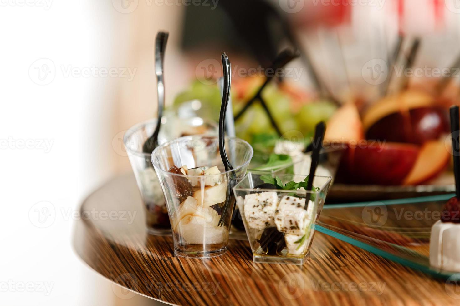 Catering. Food for parties, corporate parties, conferences, forums, banquets. different kinds of expensive cheeses with raspberries, olives. selective focus photo