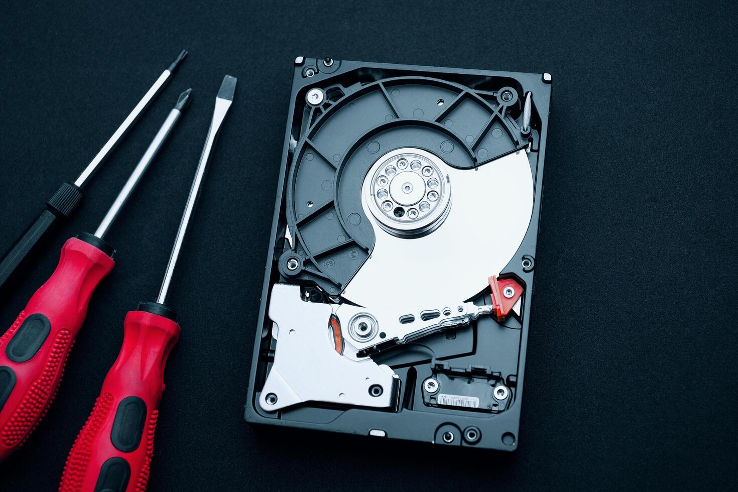 Top view uncovered hard drive and screwdrivers, Computer hardware