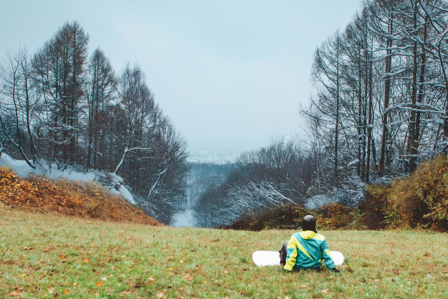 Snowboarder waiting for ski season photo