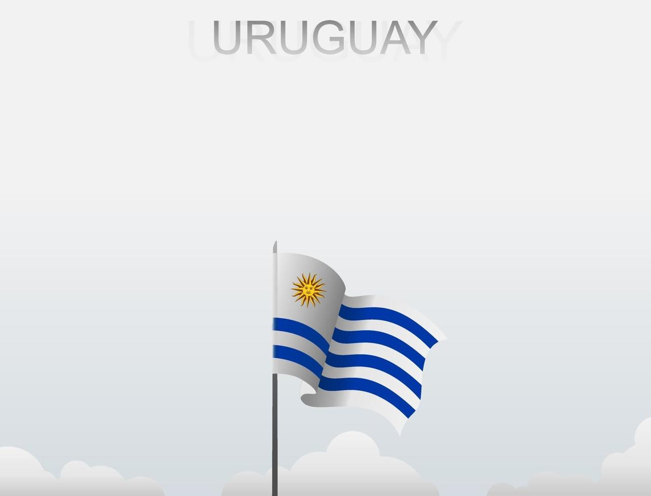 The Uruguay flag is flying on a pole that stands tall under the white sky vector
