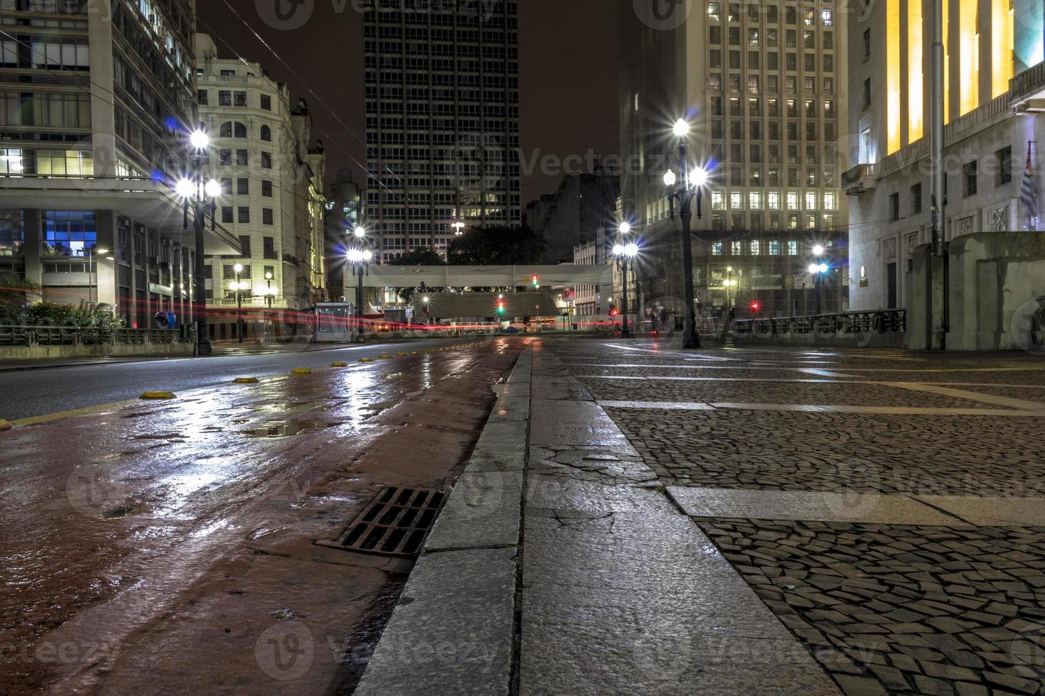 Night view of the Cha Viaduct bike path on a rainy night, in downtown Sao Paulo photo