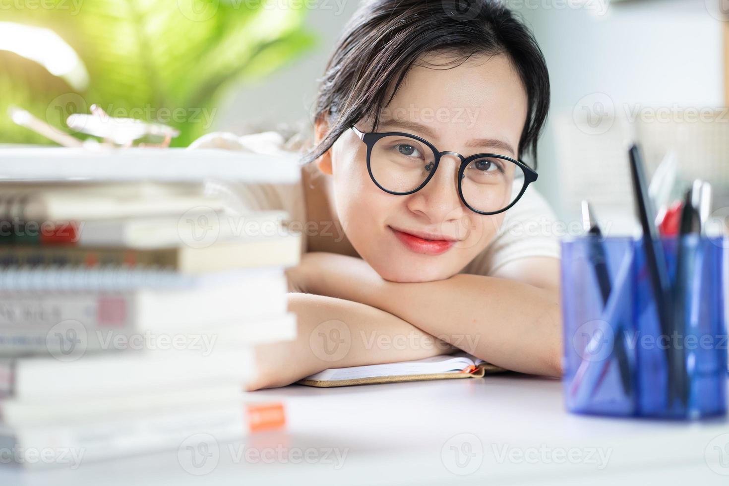 Asian young girl doing homework photo