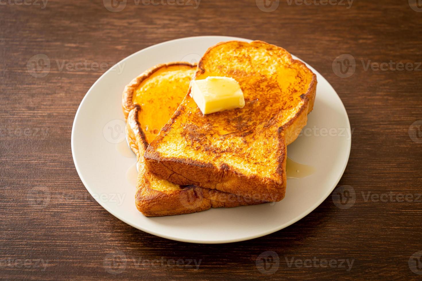 French toasted with butter and honey photo