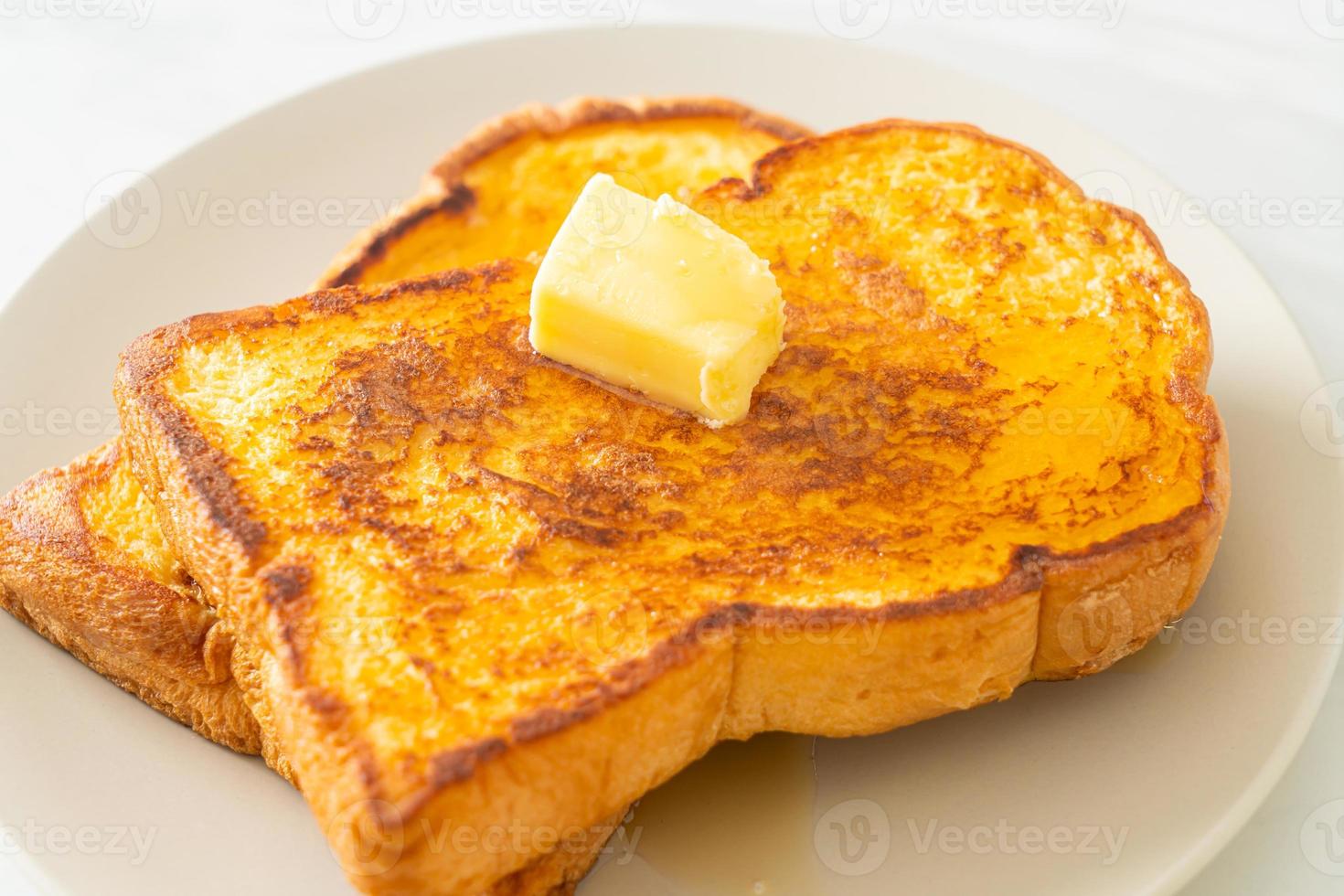 French toasted with butter and honey photo