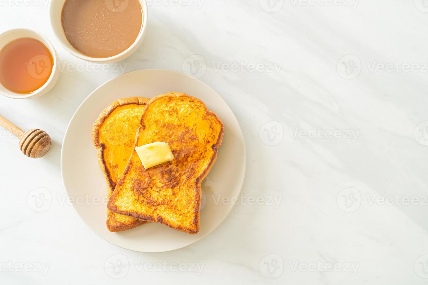 French toasted with butter and honey photo