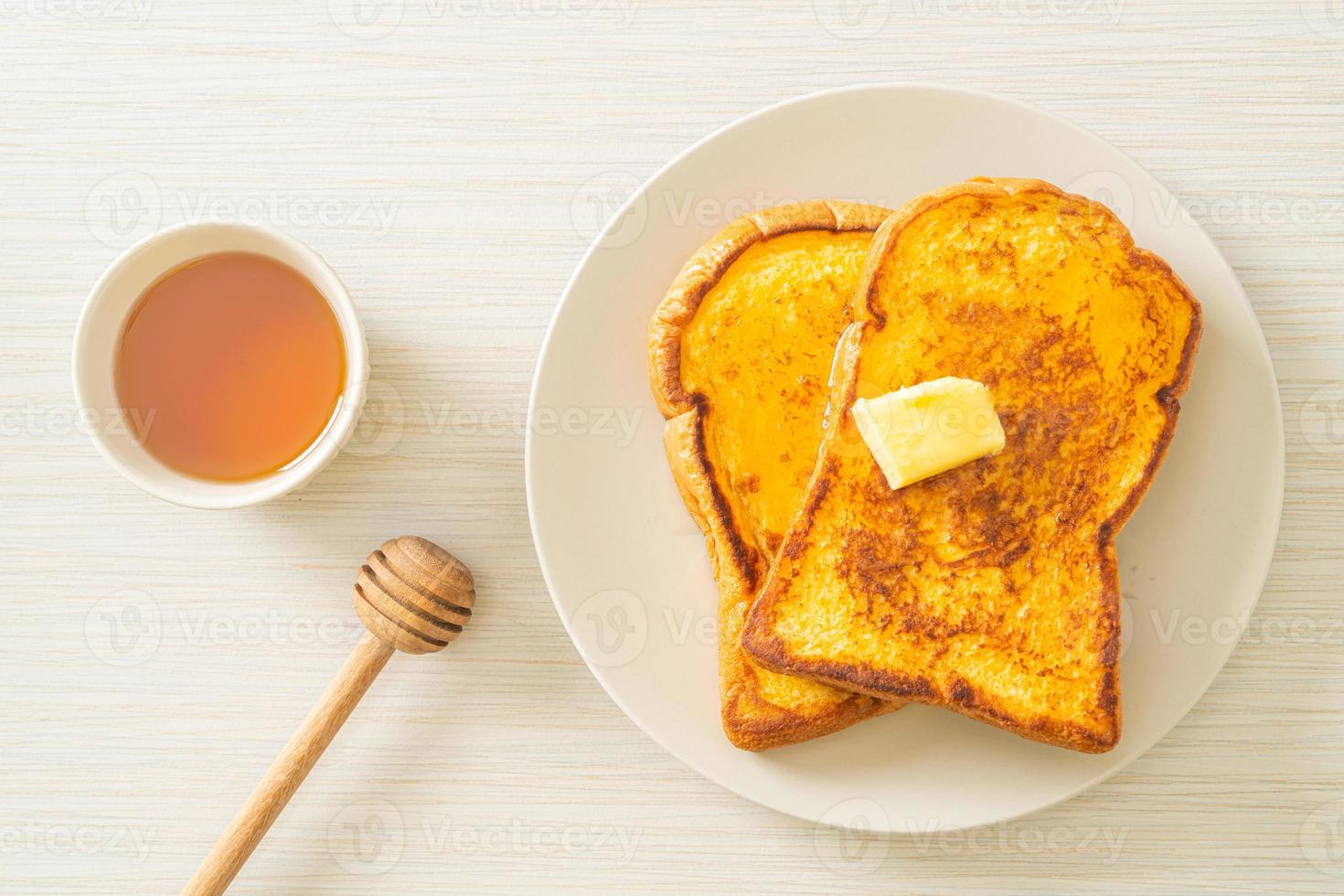 French toasted with butter and honey photo