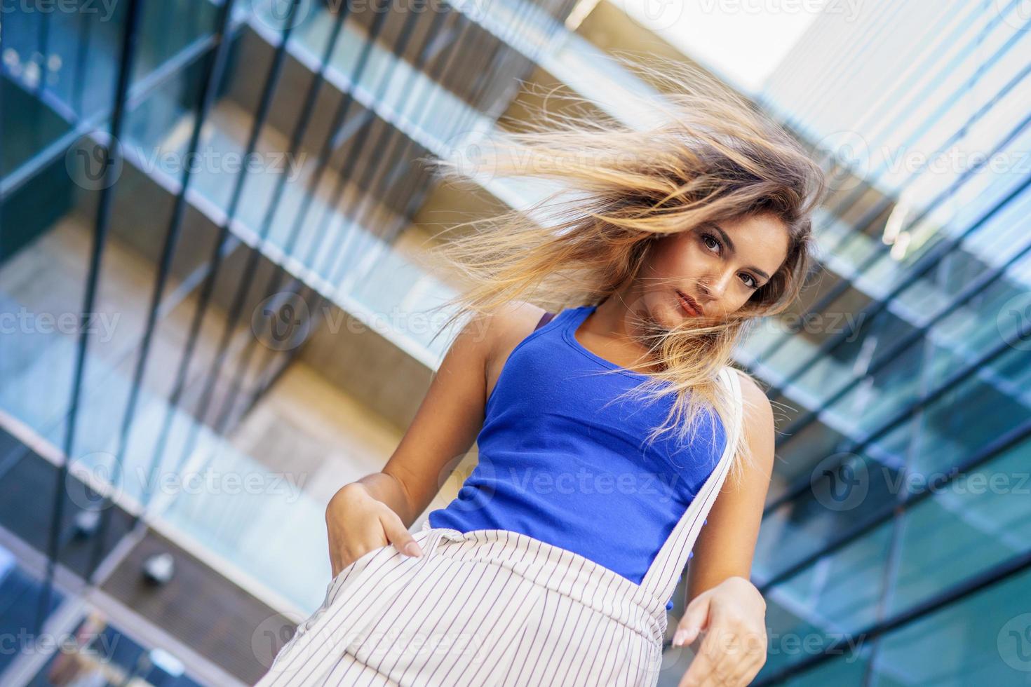 View from above of young girl moving her hair wild photo