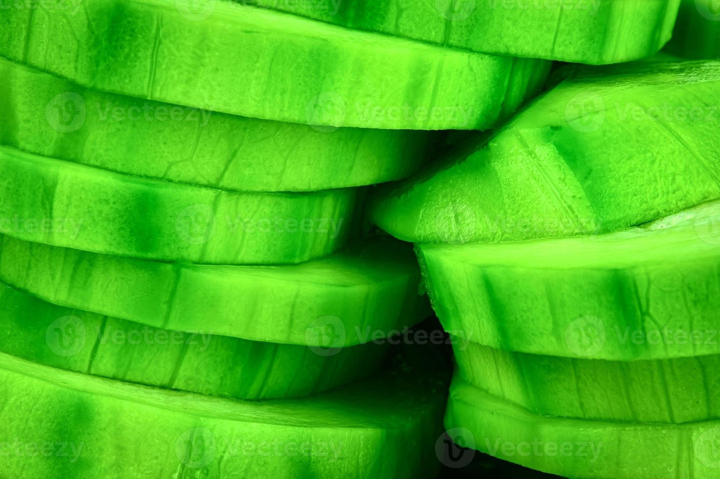 Green zucchini sliced into wheels photo