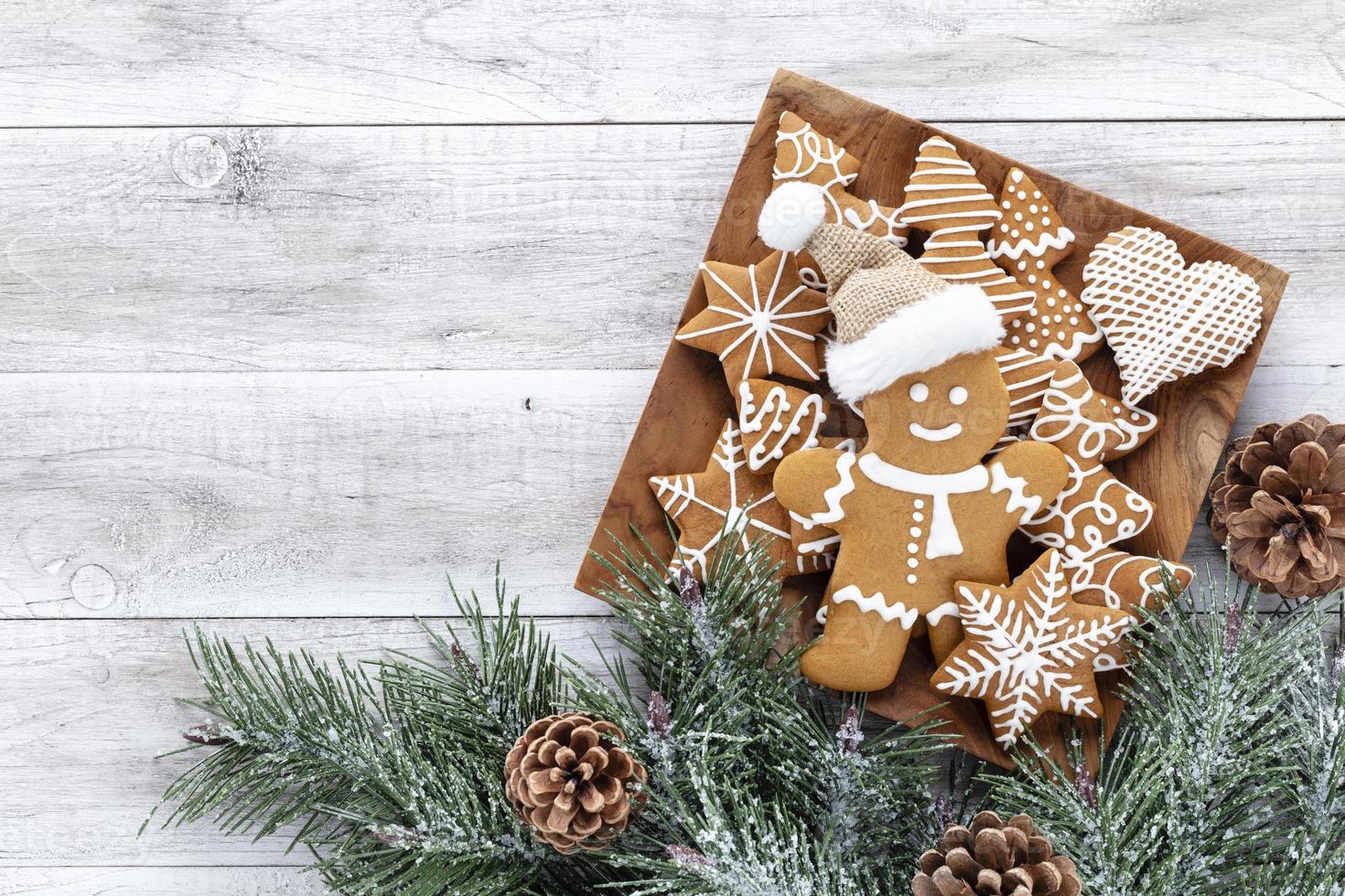Homemade christmas gingerbread cookies on wooden table photo