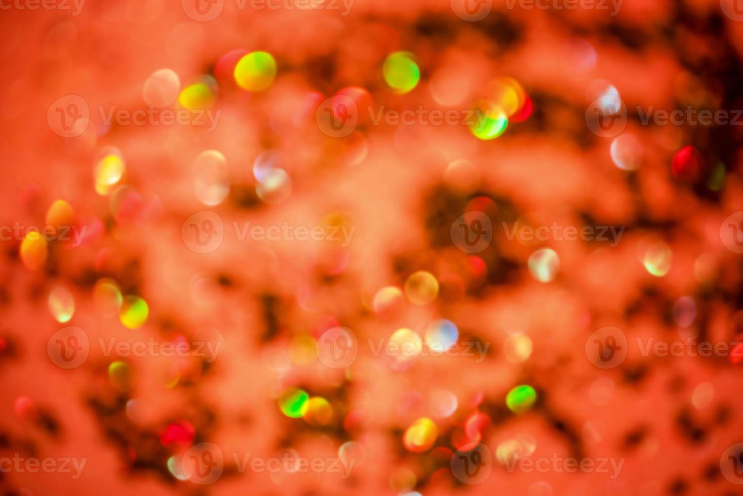 Defocus light orange and green glitter photo