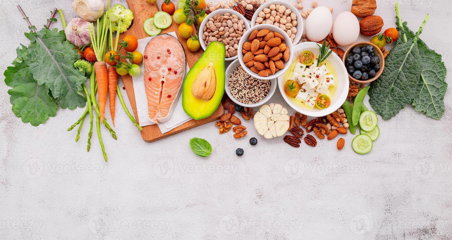 Ketogenic low carbs diet concept. Ingredients for healthy foods selection set up on white concrete background. photo