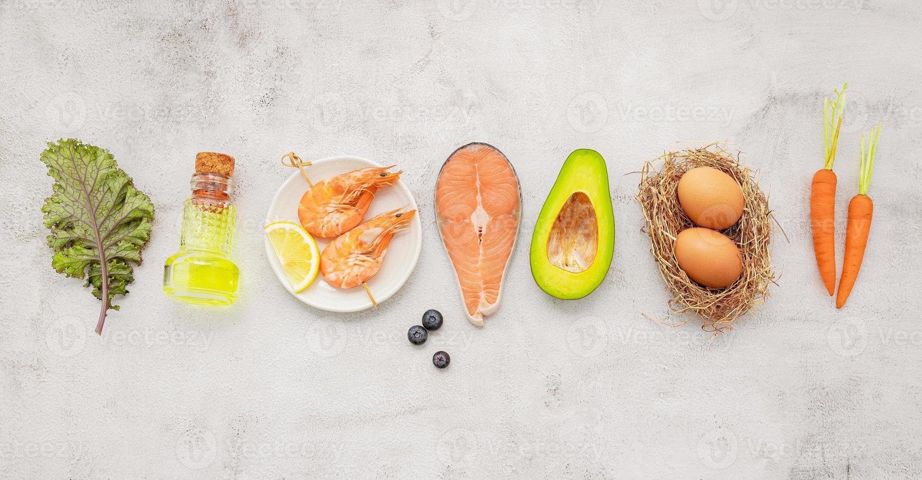 Ketogenic low carbs diet concept. Ingredients for healthy foods selection set up on white concrete background. photo