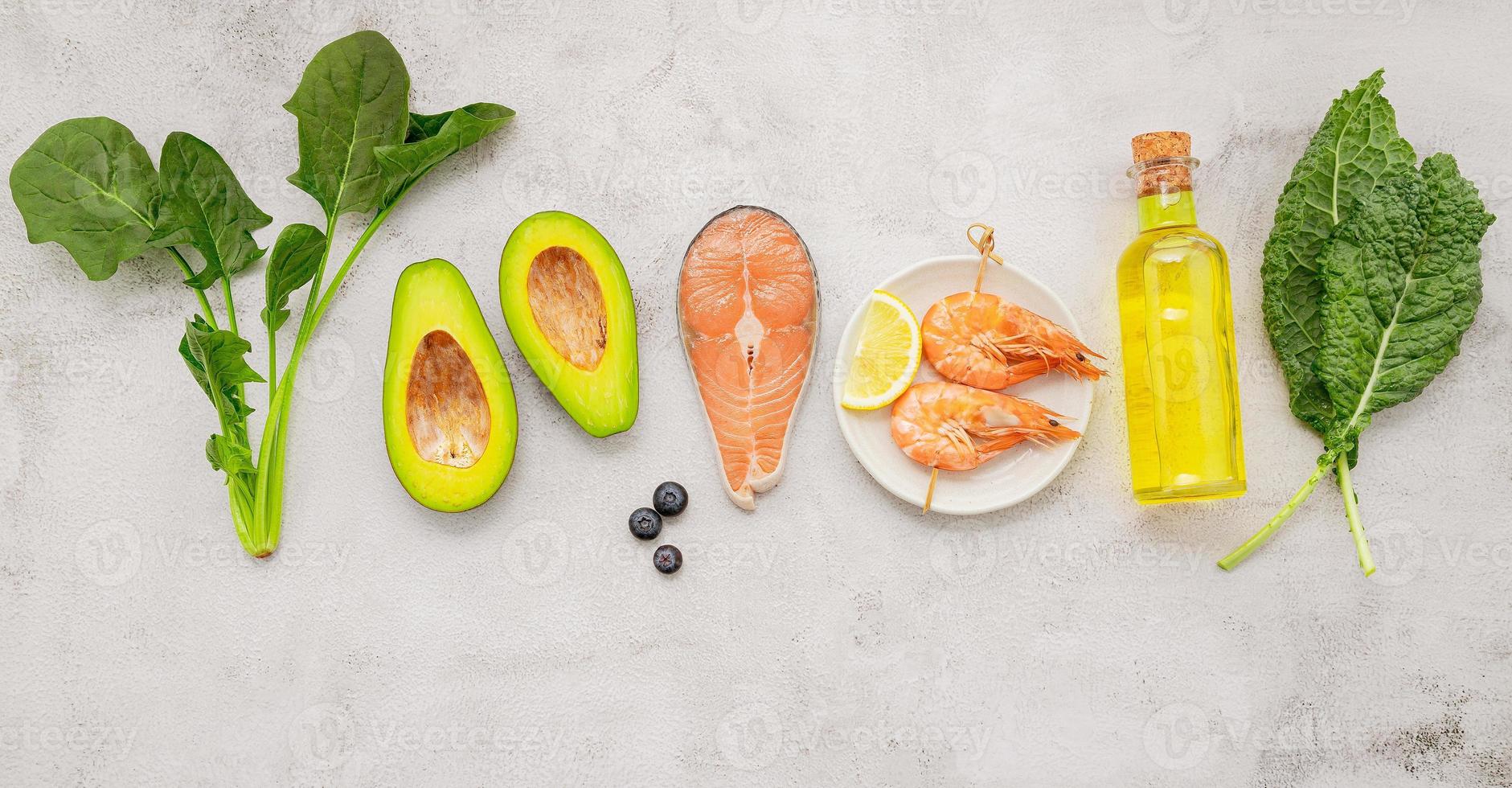 Ketogenic low carbs diet concept. Ingredients for healthy foods selection set up on white concrete background. photo