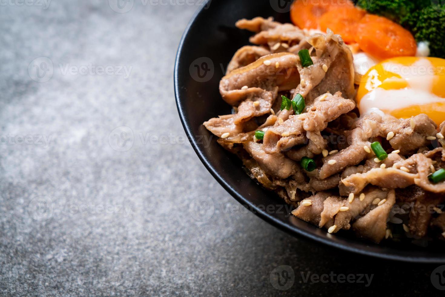 donburi, pork rice bowl with onsen egg and vegetable photo