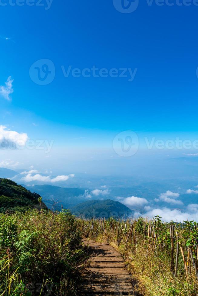 beautiful mountain layer with clouds and blue sky photo
