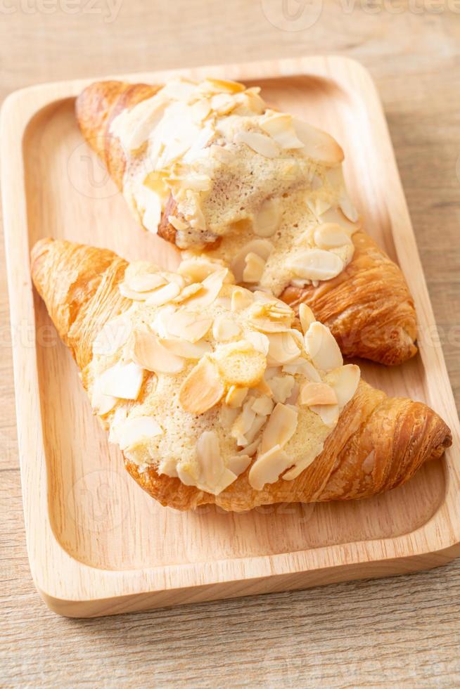 croissant with cream and almonds photo