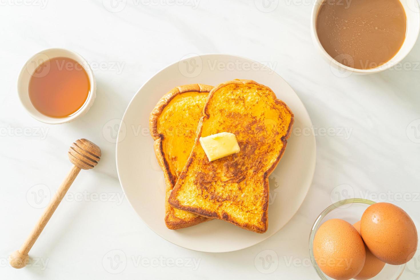 French toasted with butter and honey photo