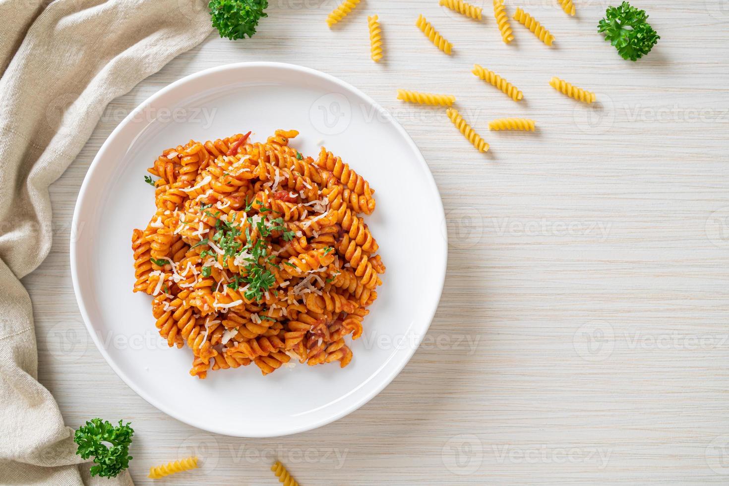 spirali or spiral pasta with tomato sauce photo