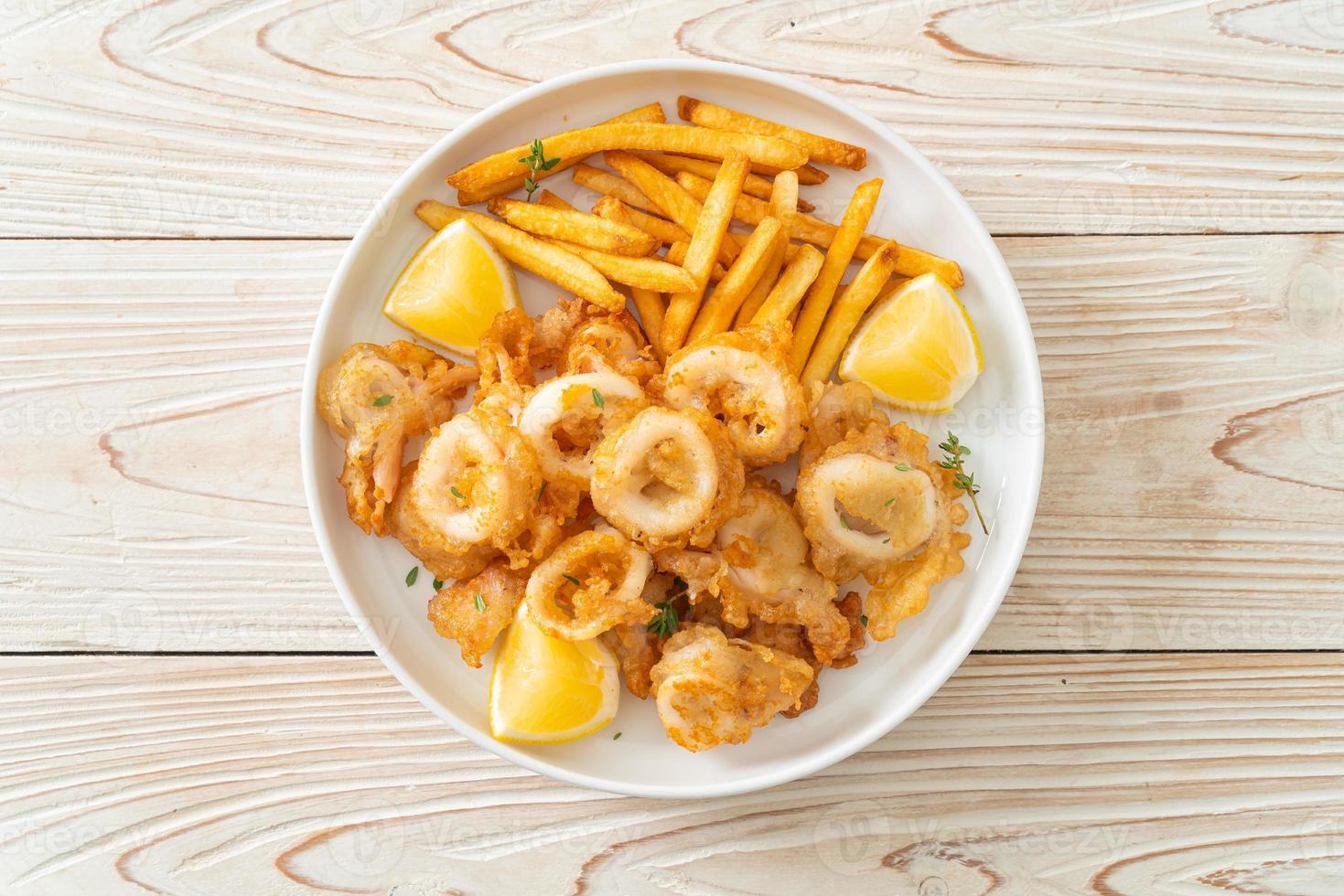 calamari - fried squid or octopus with fries photo