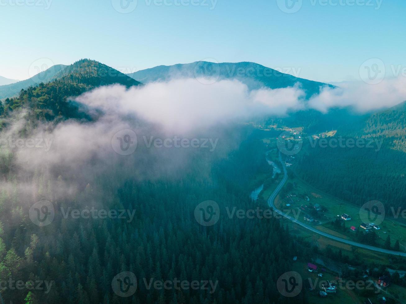 Aerial view of carpathian mountains range white clouds photo