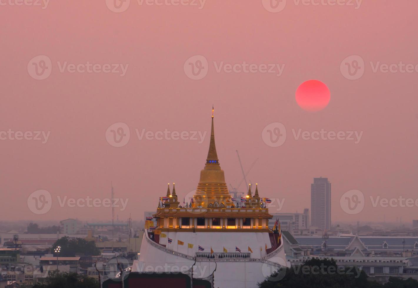 Landscape of The golden mount of Wat Saket at sunset photo