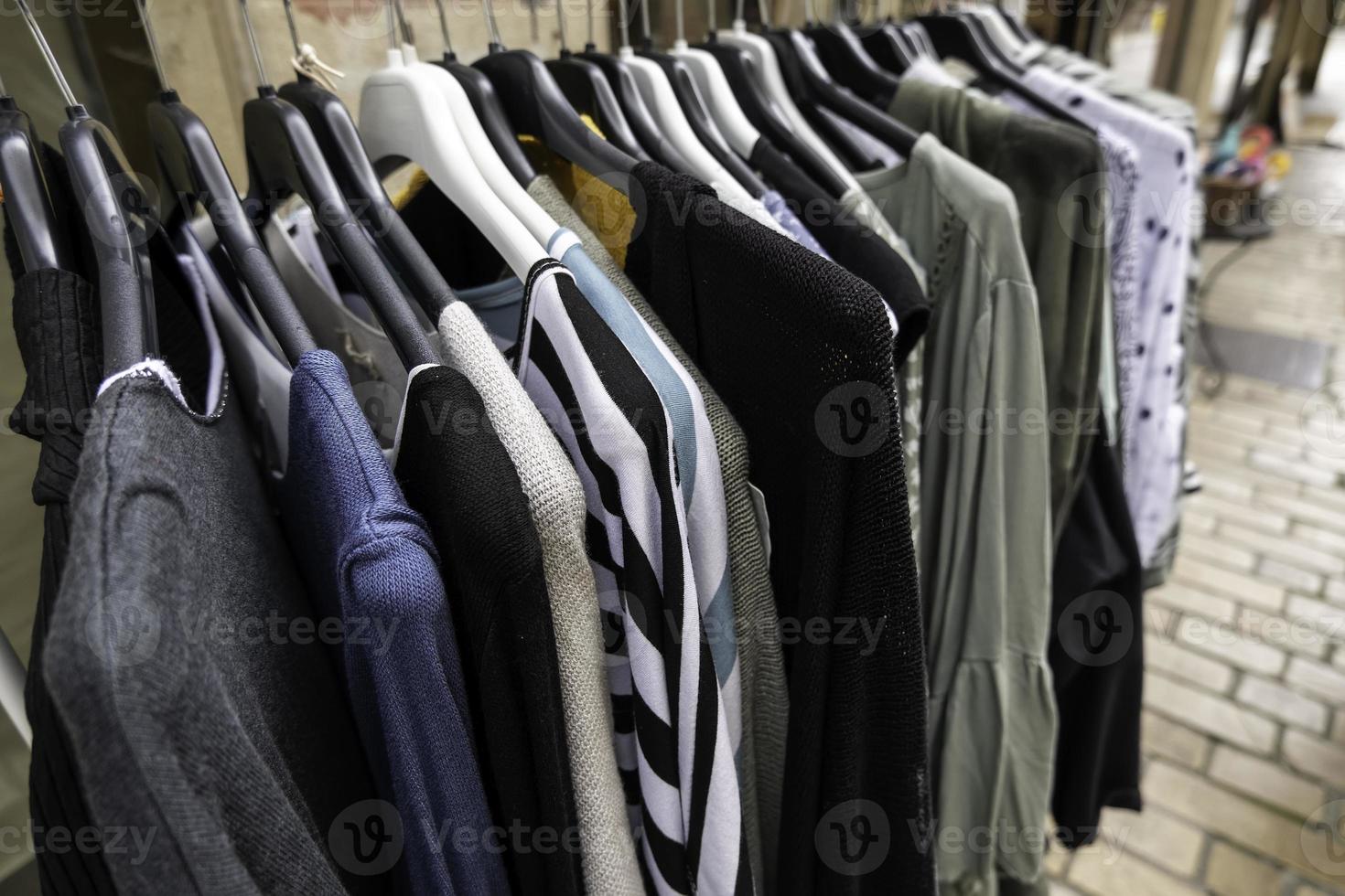 Clothes hanging on hangers photo