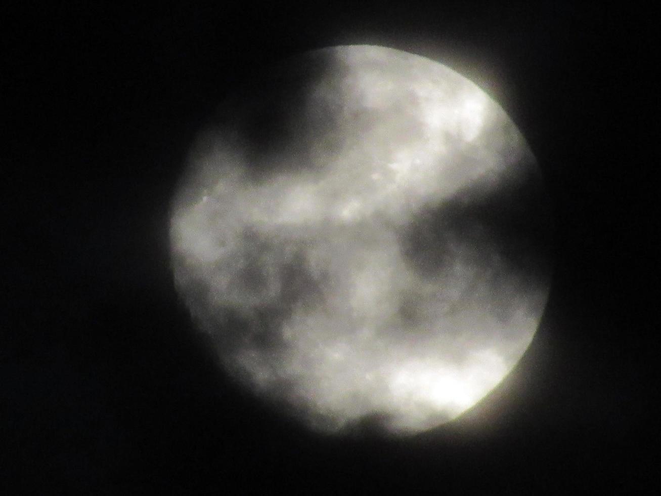 Full moon in the night sky. Moon on the black background photo