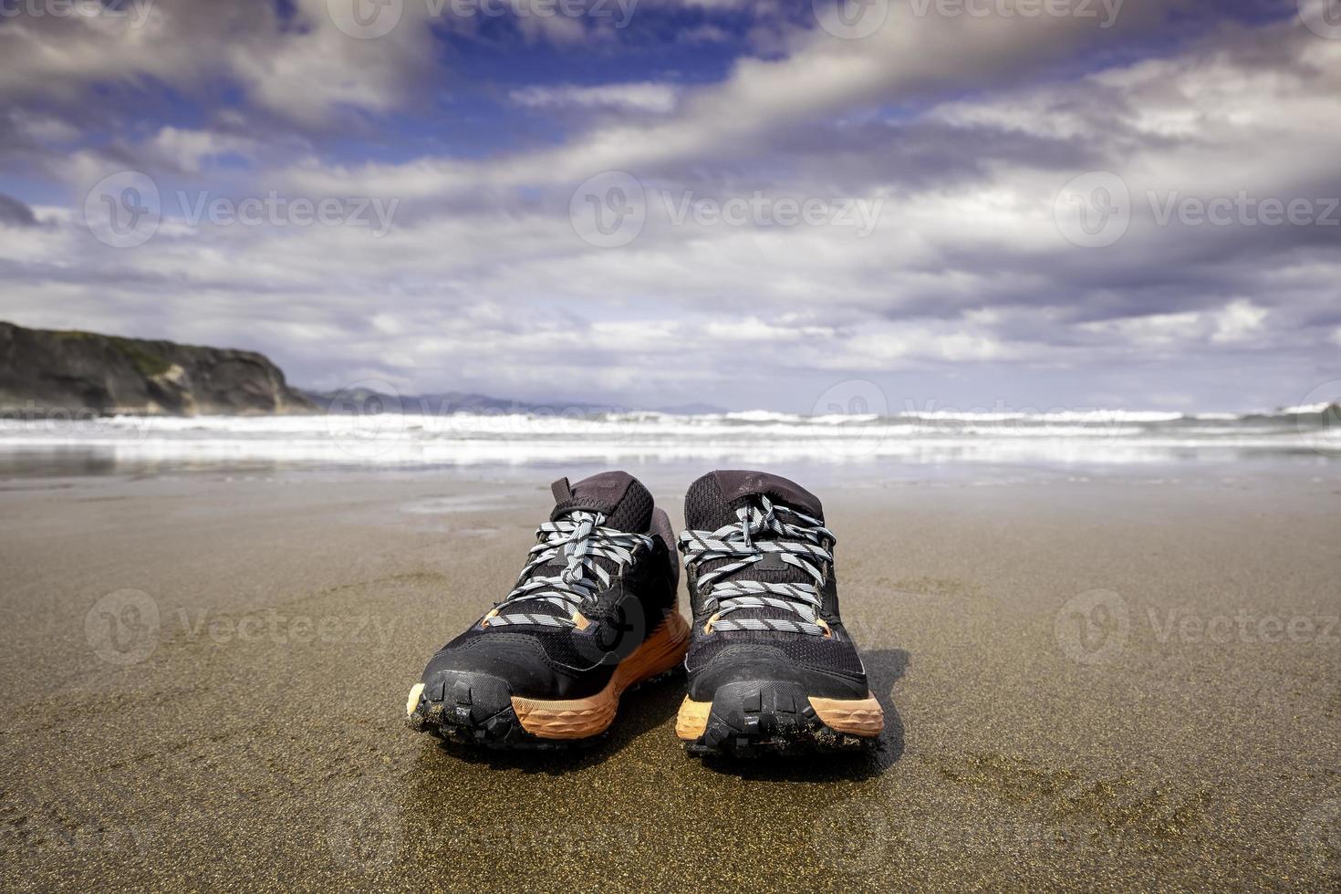 Slippers alone on the beach photo