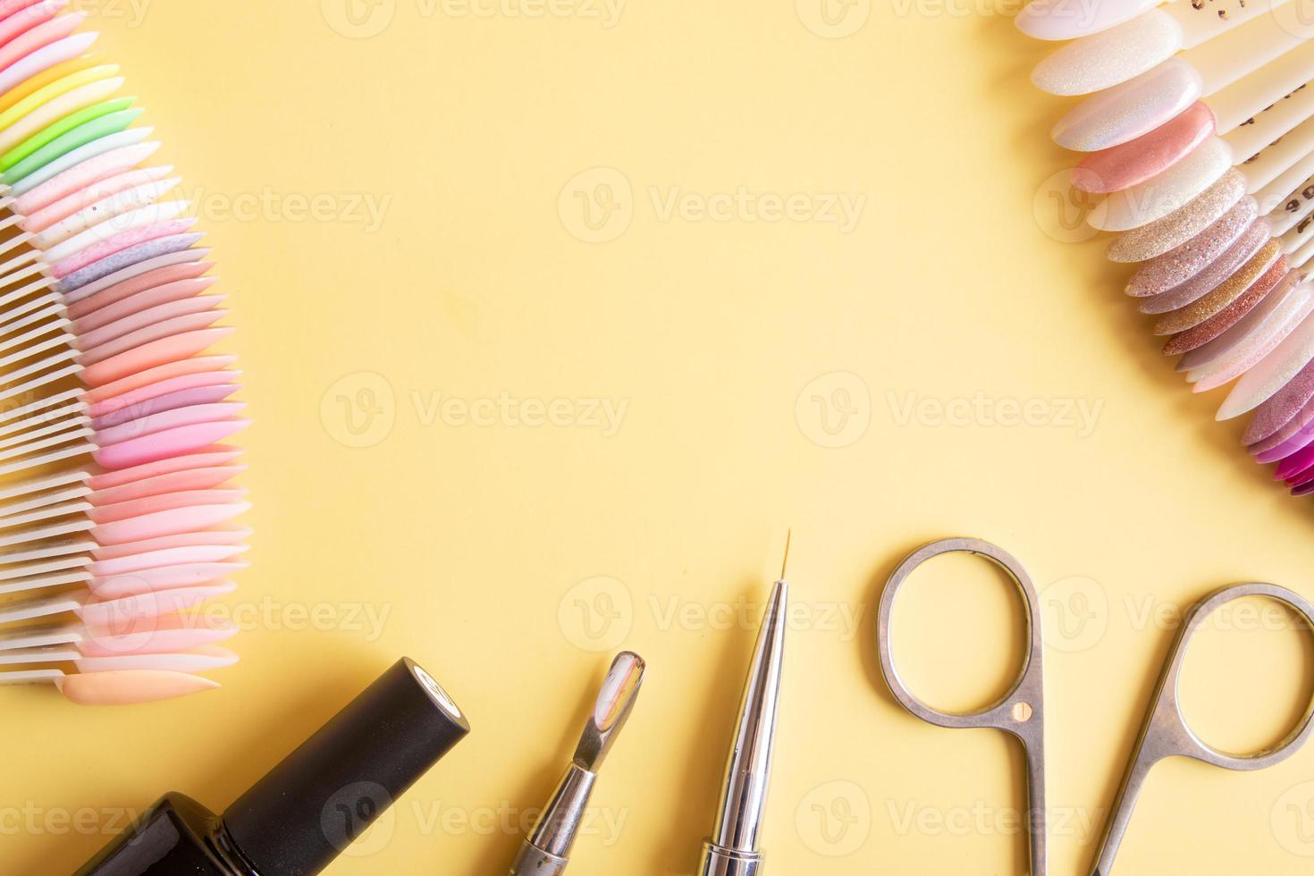 Flat lay manicure tools on a colored background with copy space photo