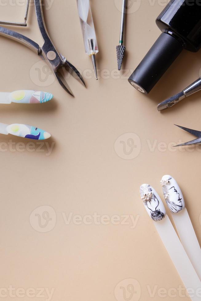 Manicure tools and tips with copy space drawings photo