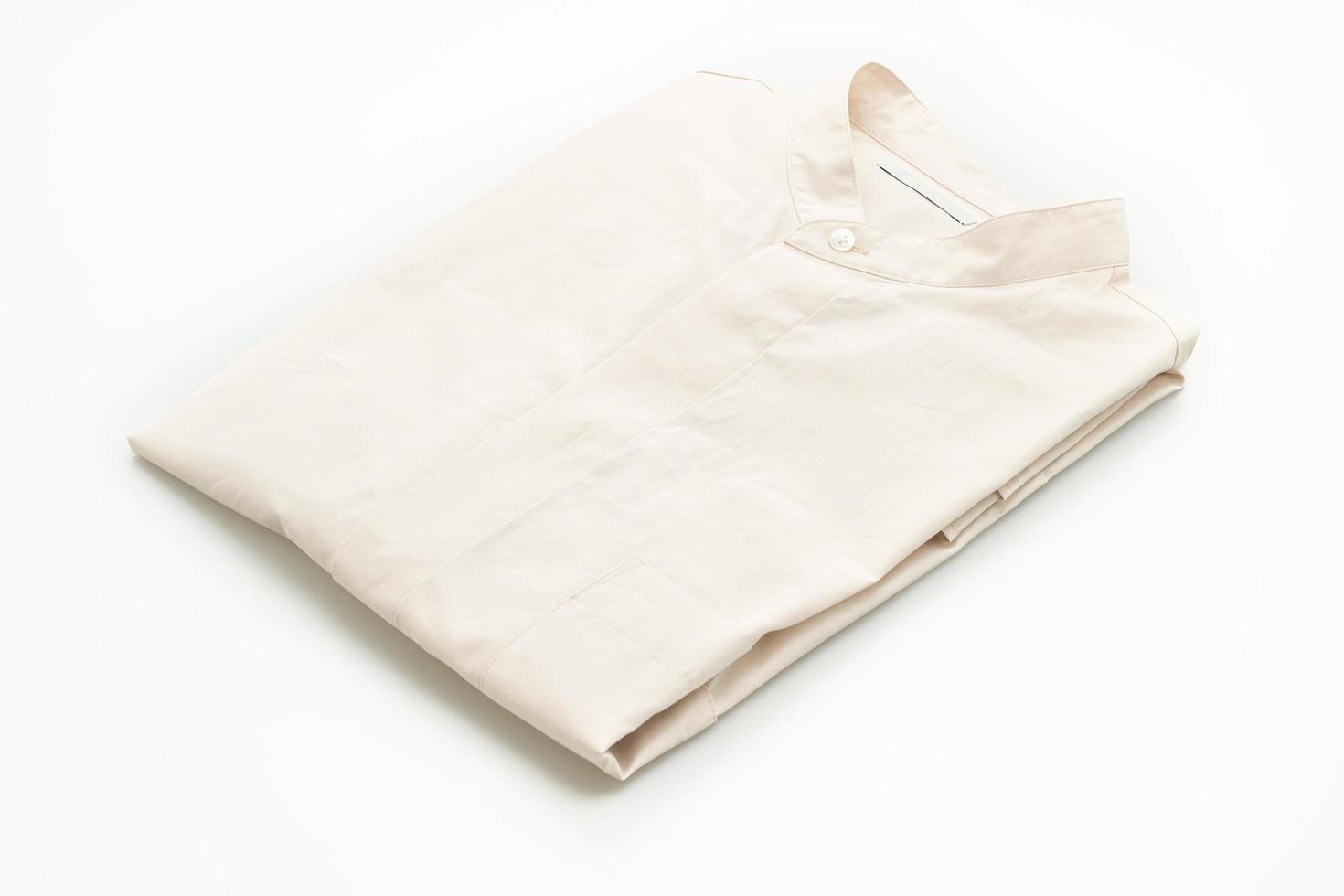 beige shirt fold on white background photo
