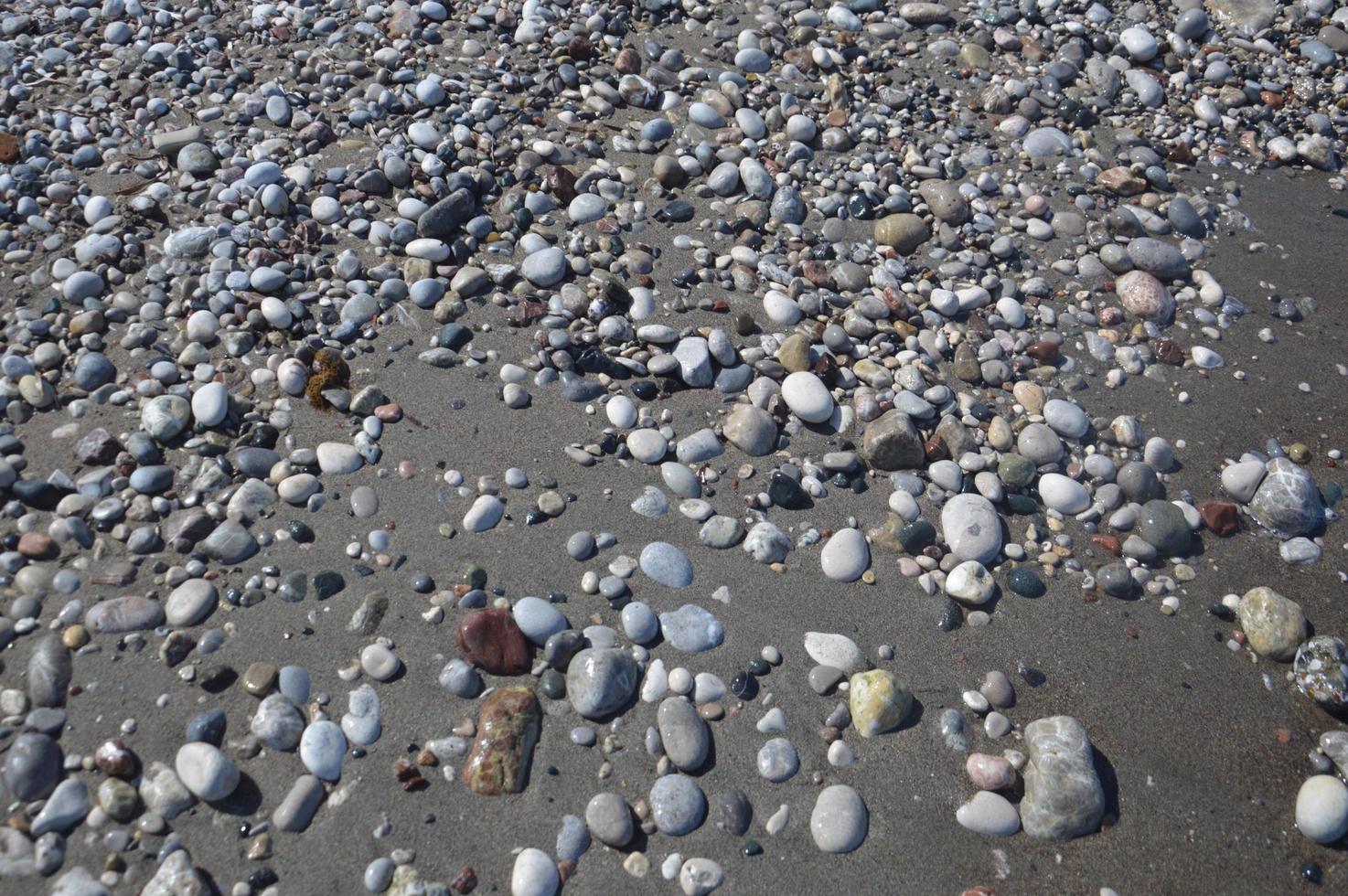Pebble texture on the Aegean coast in Greece photo