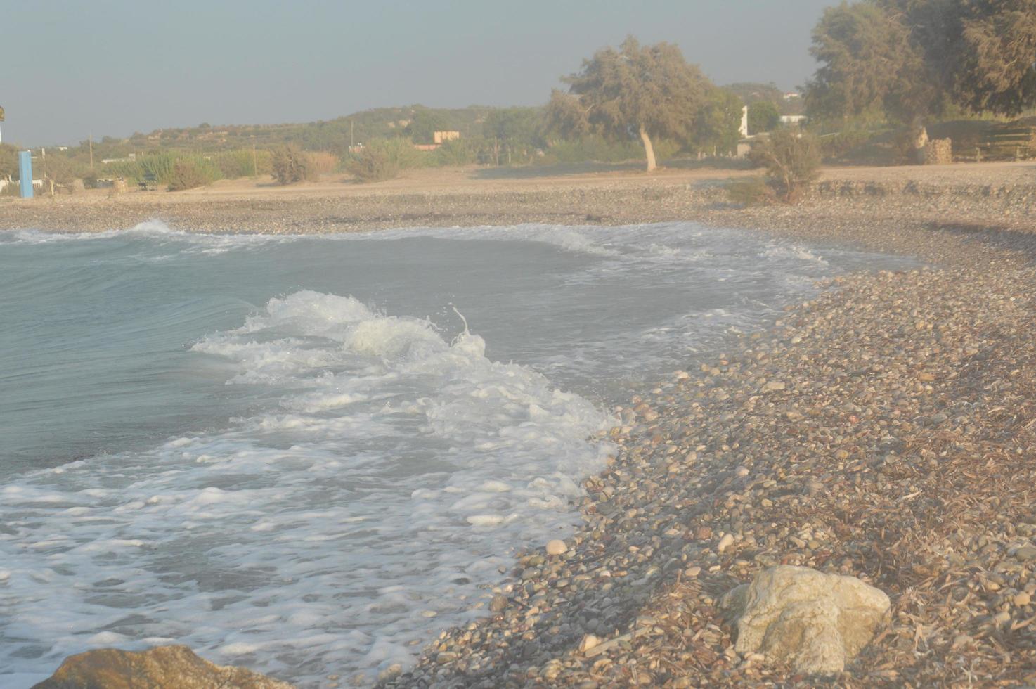 Stones on the background of the Aegean storm on the island of Rhodes in Greece photo