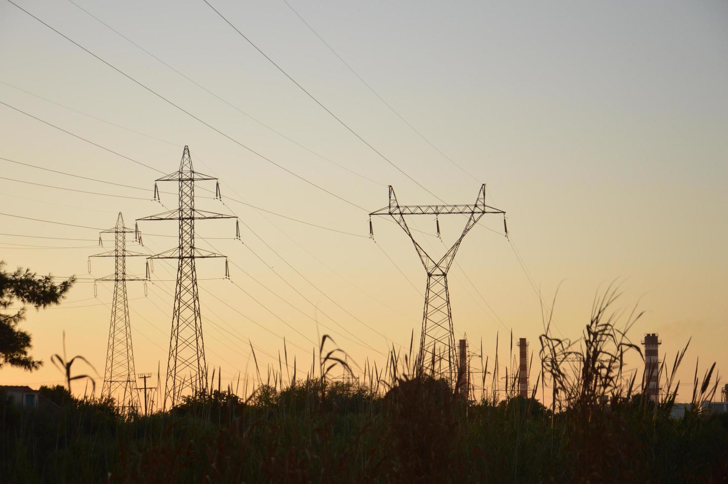 Poles and wires of high-voltage power lines photo