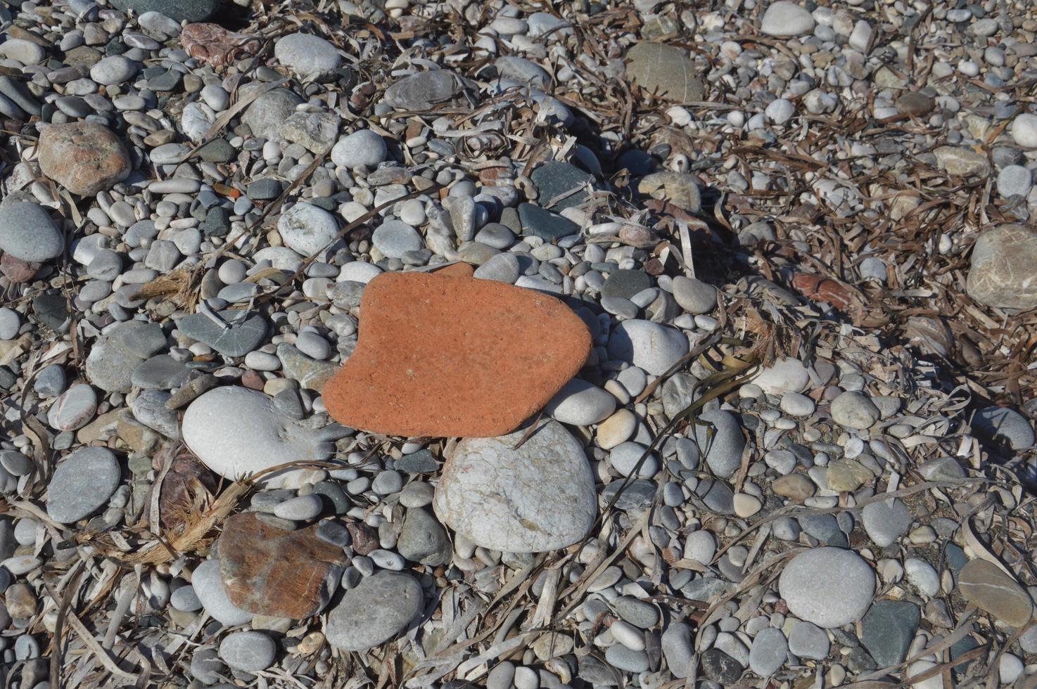 Pebble texture on the Aegean coast in Greece photo