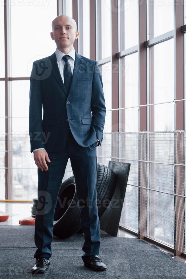 Portrait of smiling young businessman in office photo