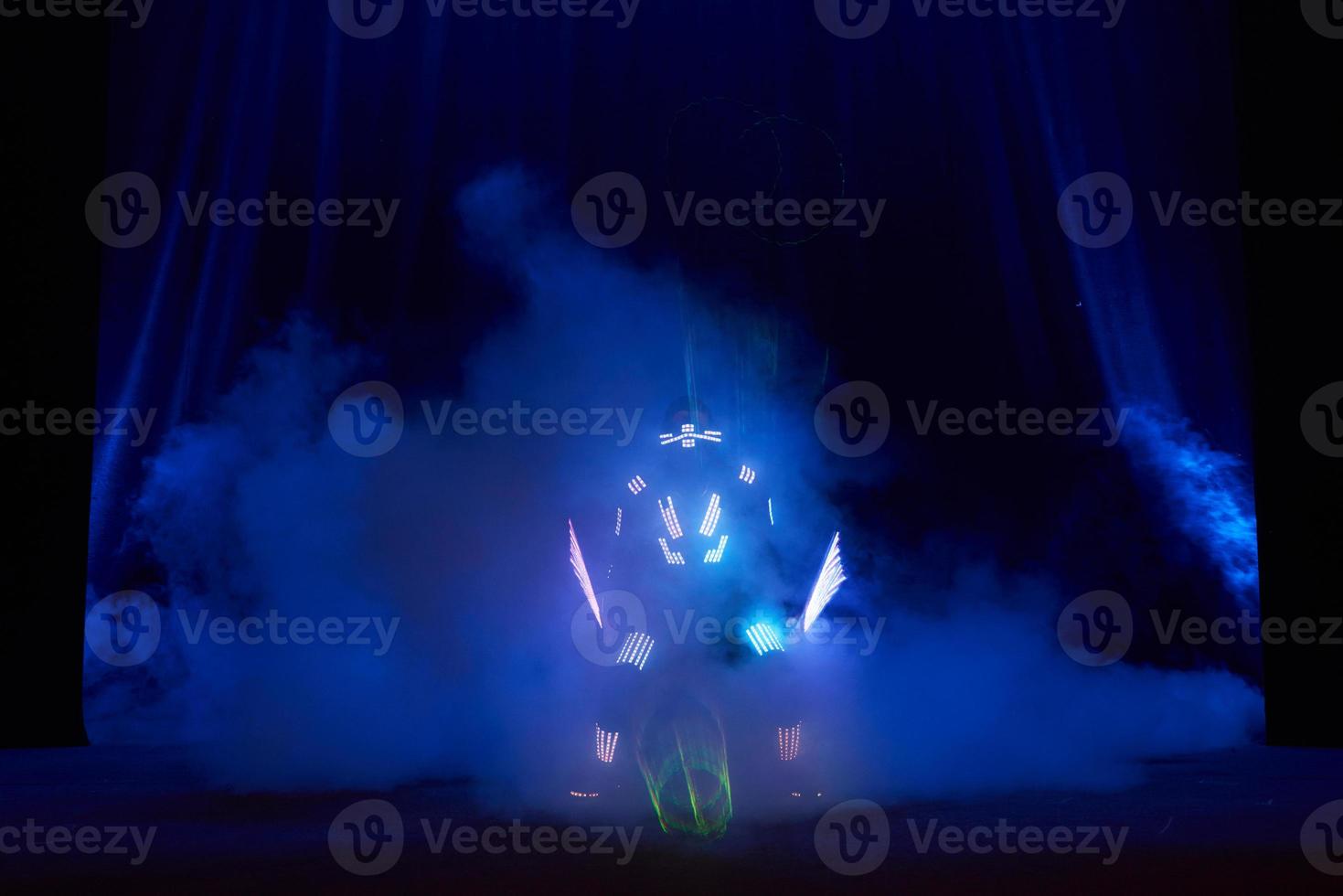Laser show performance, dancers in led suits with LED lamp, very beautiful night club performance, party photo