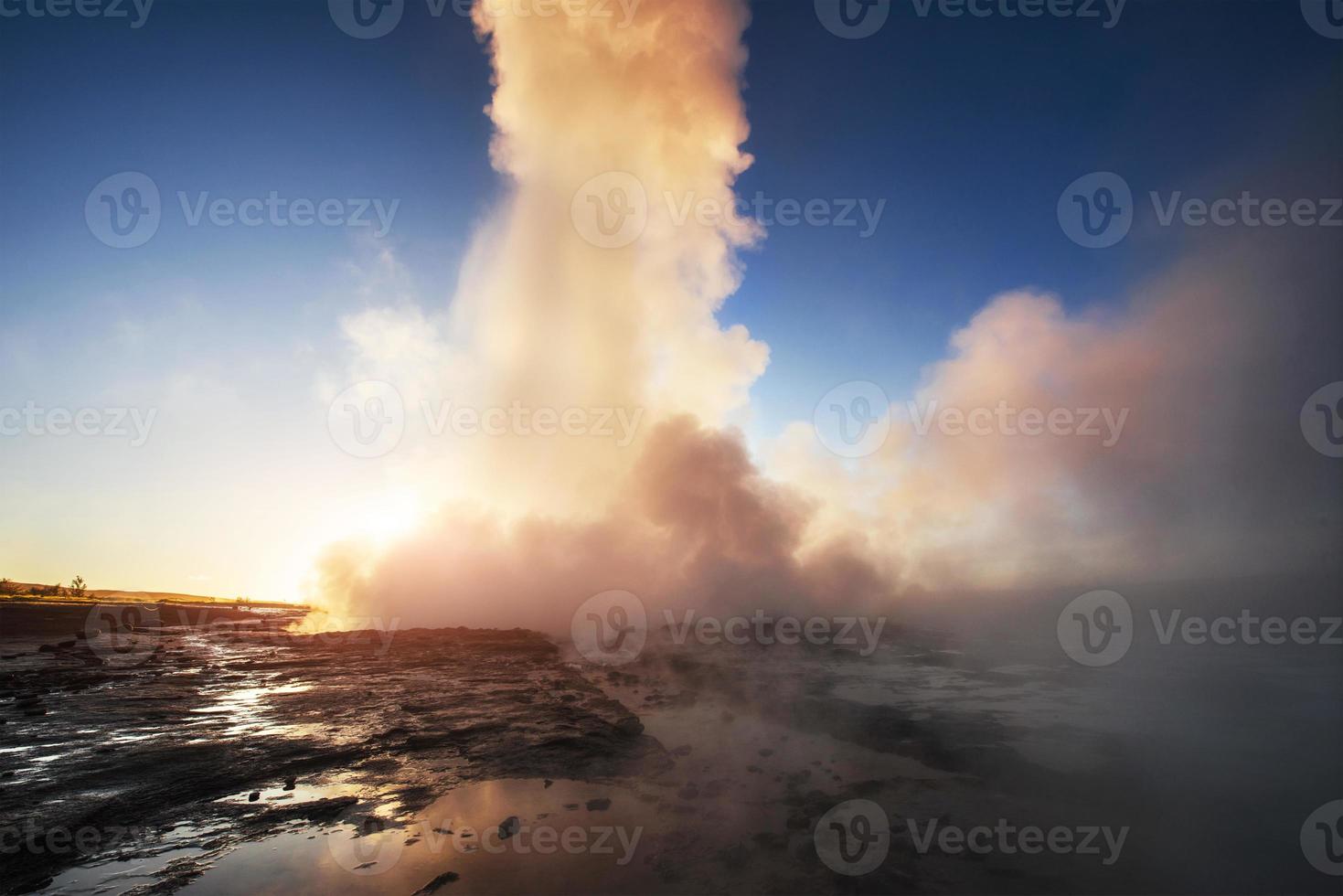 Fantastic sunset Strokkur geyser eruption in Iceland. Fantastic colors photo