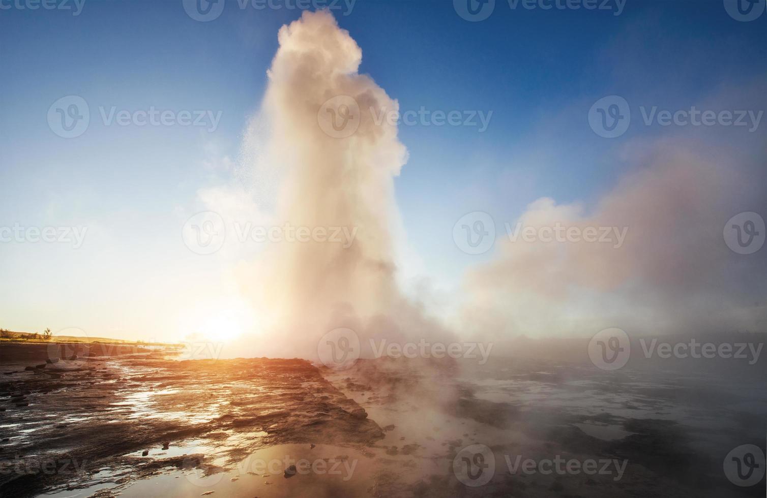Fantastic sunset Strokkur geyser eruption in Iceland. Fantastic colors photo