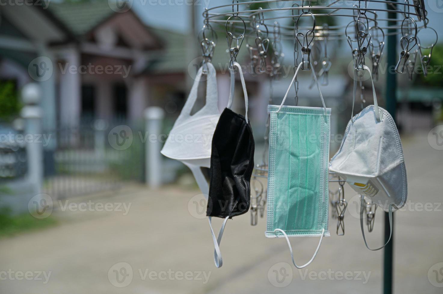 Mask on the clothes rack in the sun. photo