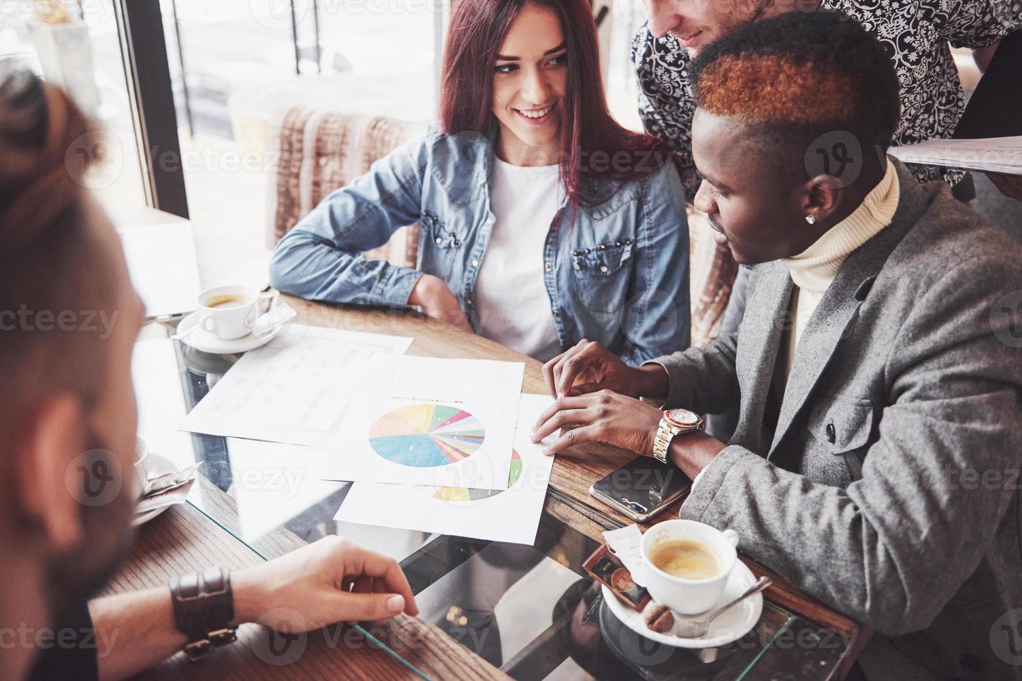 Group of casually dressed businesspeople discussing ideas. Creative professionals gathered for discuss the important issues of the new successful startup project. Teamwork Brainstorming Concept photo