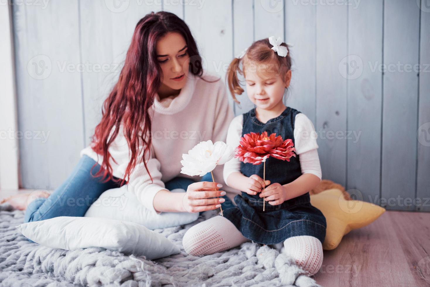 Happy loving family. Mother and her daughter child girl playing photo