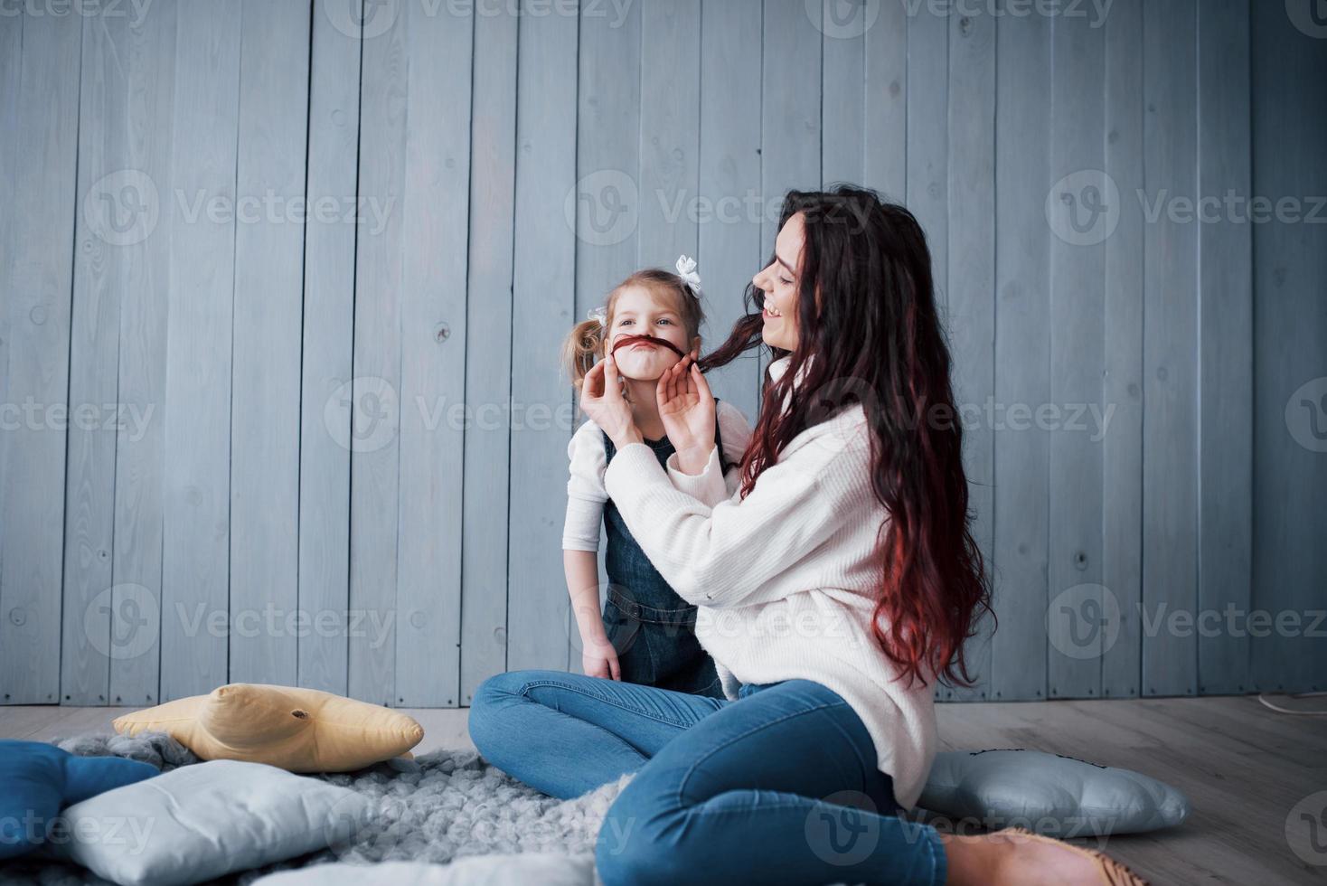 Happy loving family. Mother and her daughter child girl playing together photo