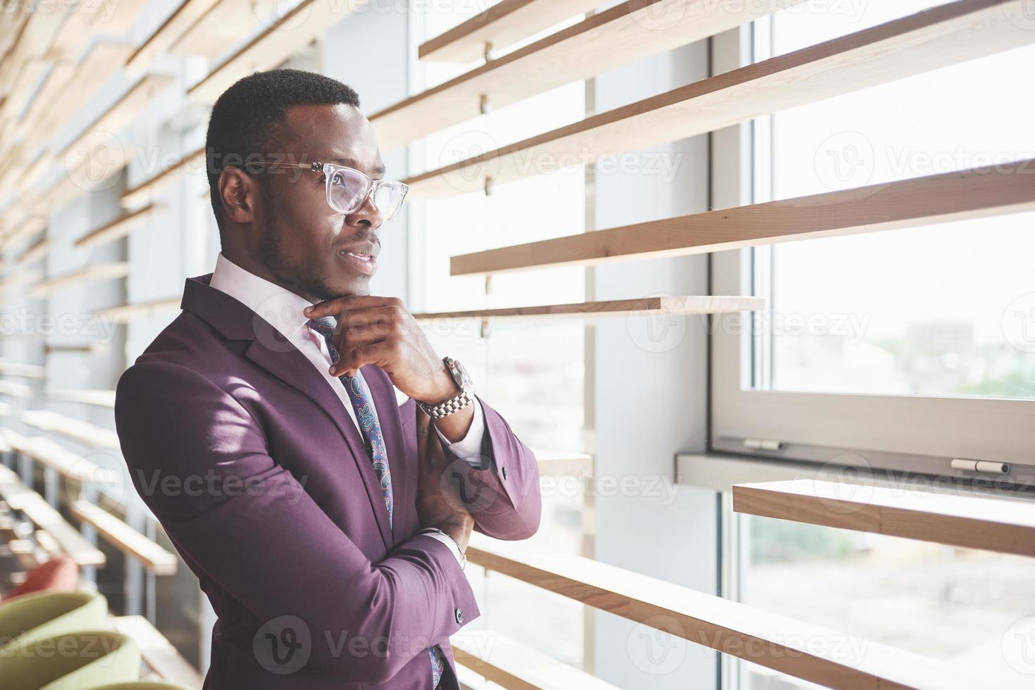 A beautiful young African American who thinks about a serious idea. Confident in making business decisions photo