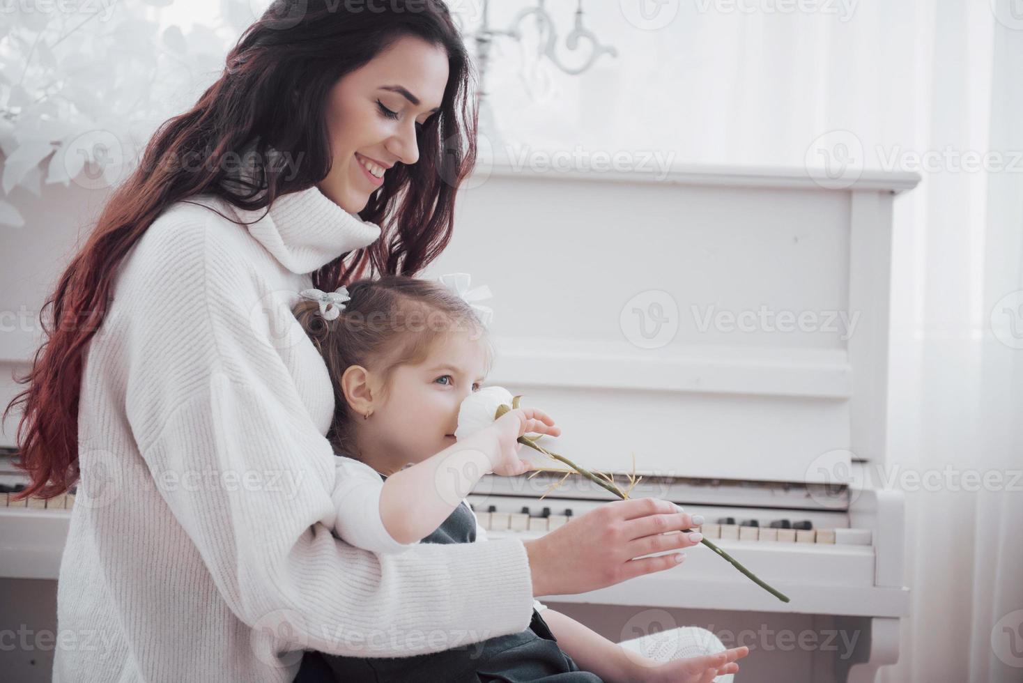 Happy loving family. Mother and her daughter child girl playing together photo