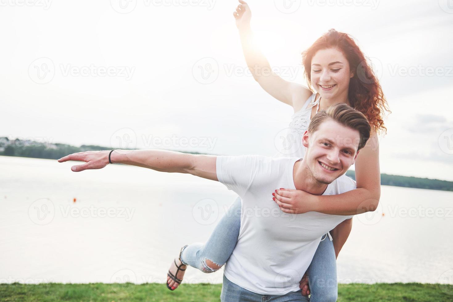 Loving funny playful happy couple on the beach. photo